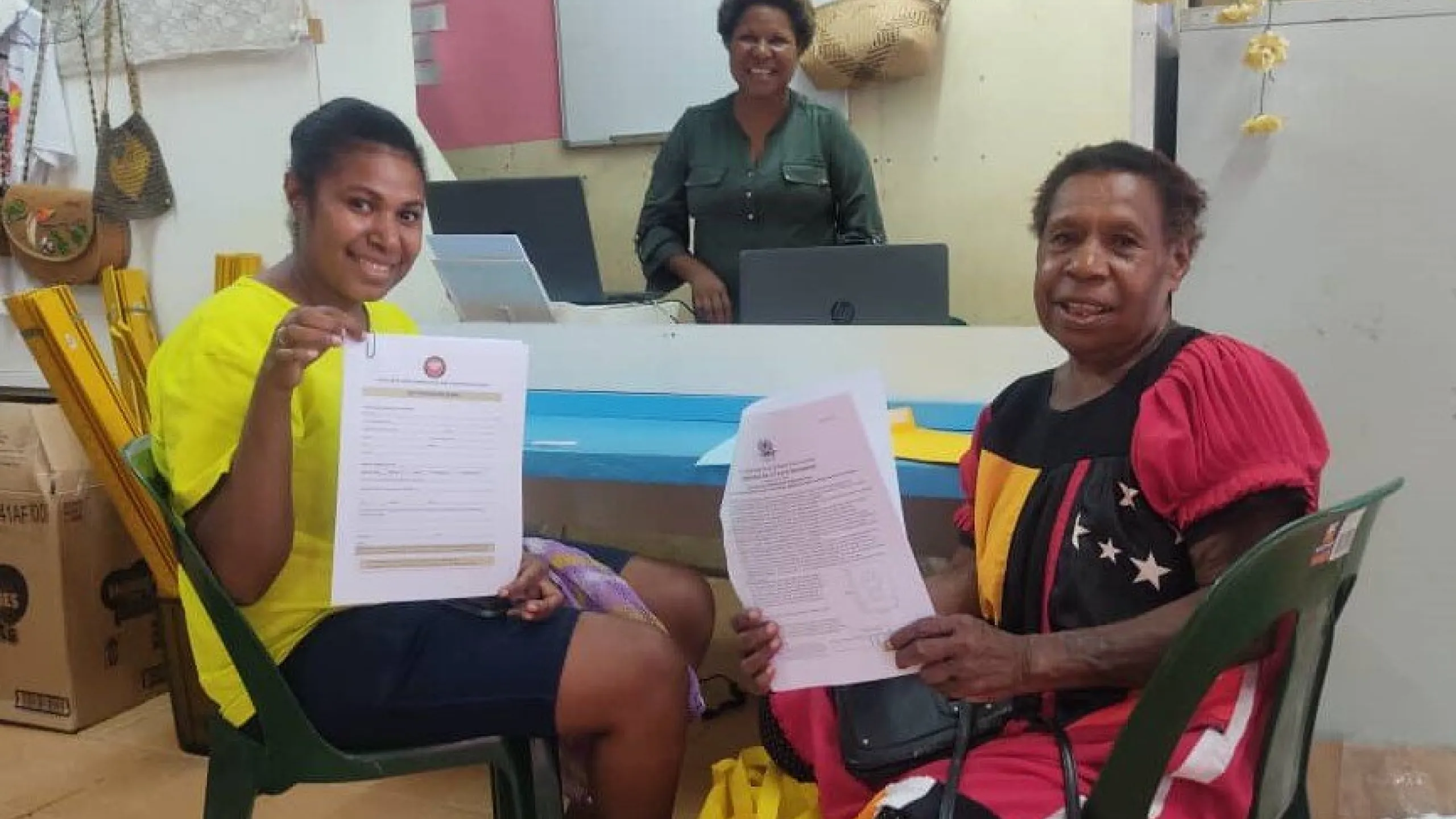 Glenda-Supring-Glenda-center-serving-her-first-passport-visa-service-customers