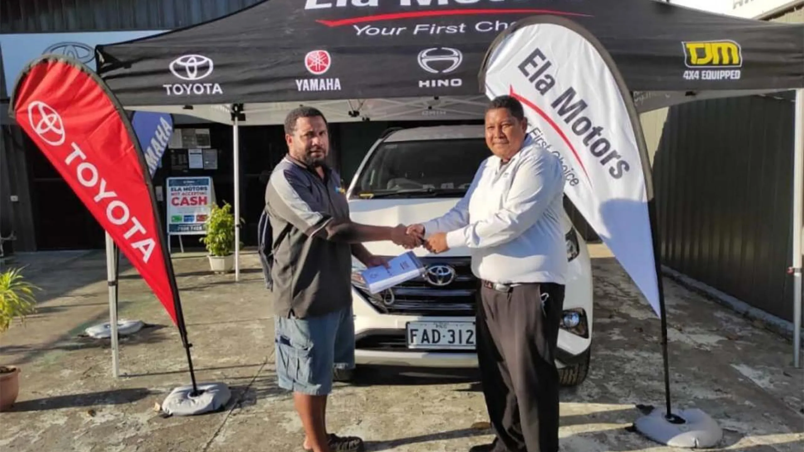 Noah receiving the Toyota Rush from Ela Motors