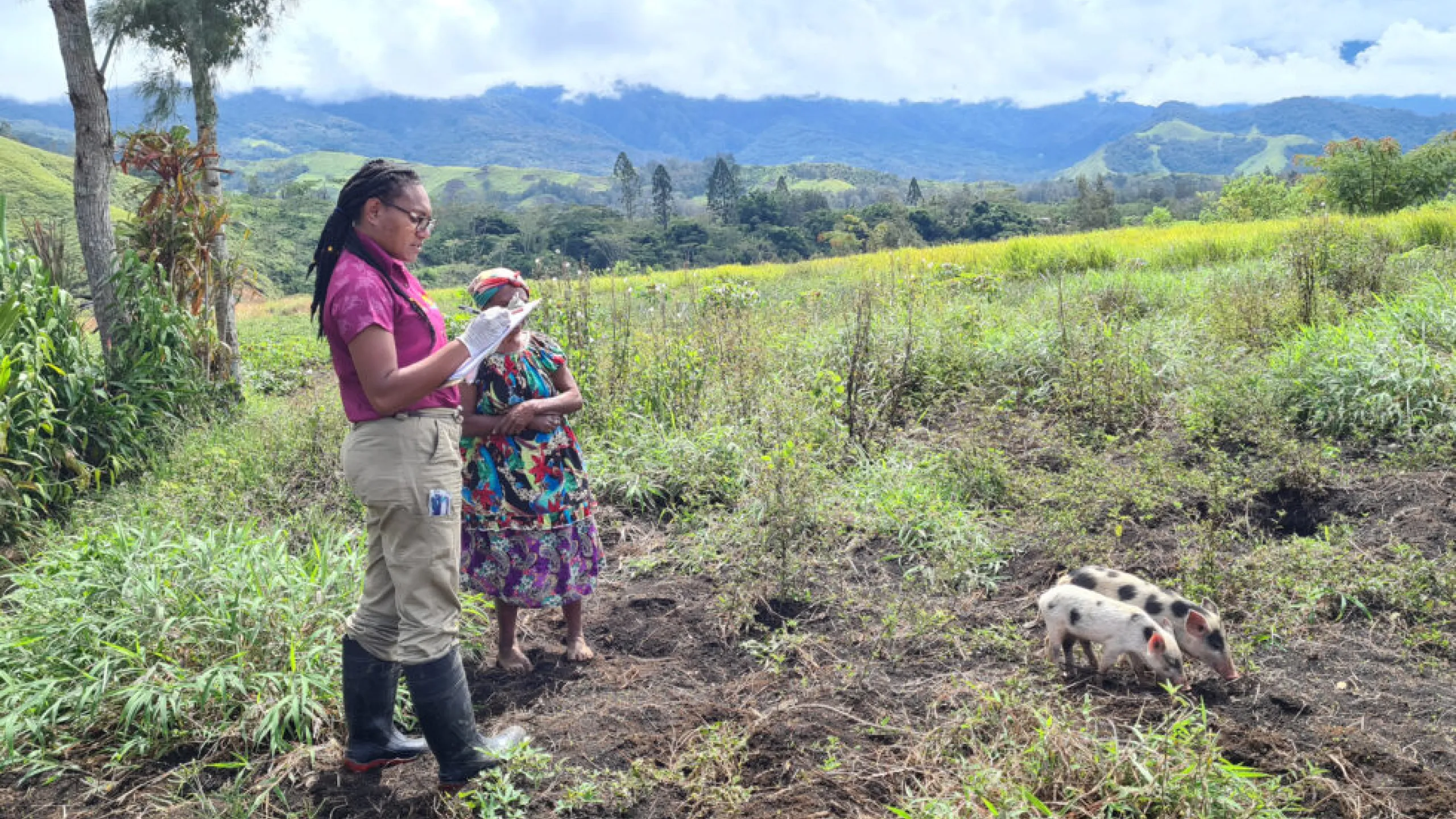 Tania-working-in-the-field-checking-poultry-and-pigs
