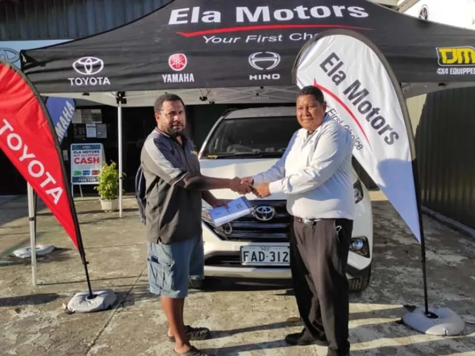 Noah receiving the Toyota Rush from Ela Motors